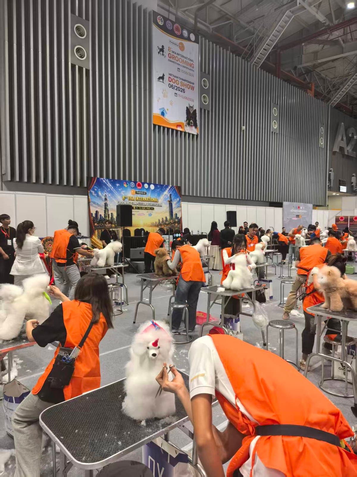 Pet-care demonstration area with event staff at Petfair Vietnam 2026.